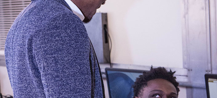 Eric Sloan, Jr. assisting students